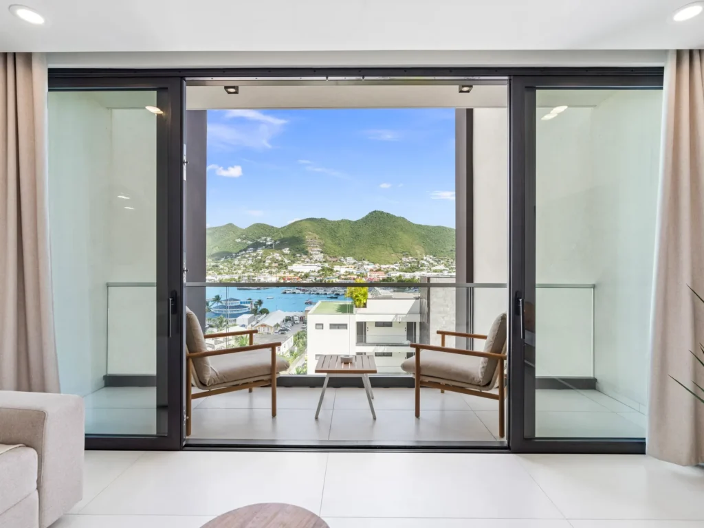 Private balcony with lagoon view from luxury condo at The Hills Residence Simpson Bay